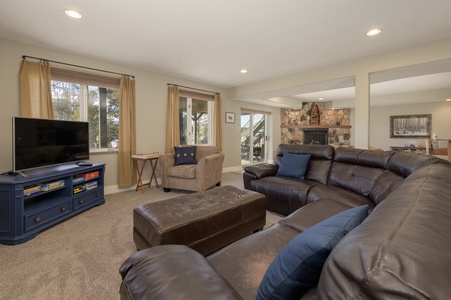 A spacious sectional in the basement additional living room.