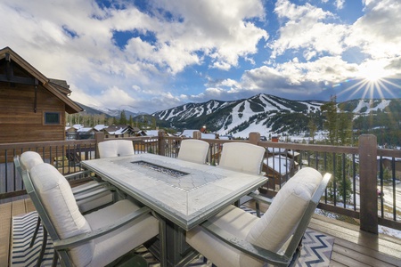- Fire table dining setup lets you enjoy meals and drinks with jaw dropping views - Cushioned chairs and spacious seating create a comfortable social vibe - Ski slopes in the distance make this patio unforgettable in any season