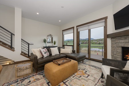 Mountain Views from living room with a gas fireplace