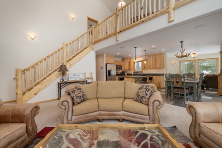 Open concept living area with high ceiling and comfortable seating