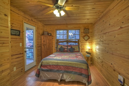 Happy Trout Hideaway- Upper level queen bedroom with deck access