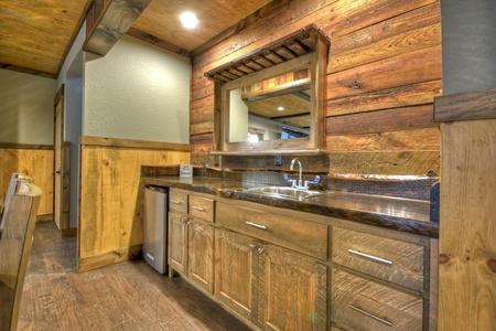 New Heights- Wet bar area with a sink and mirror