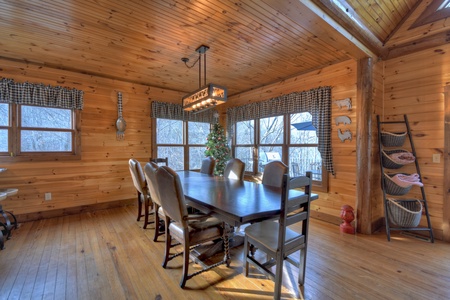River Lodge- Large dining room area with table and chairs