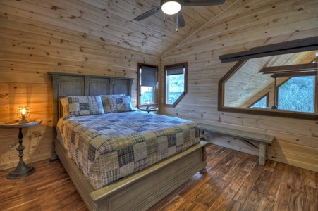 Whisky Creek Retreat- Upper queen bedroom with loft windows