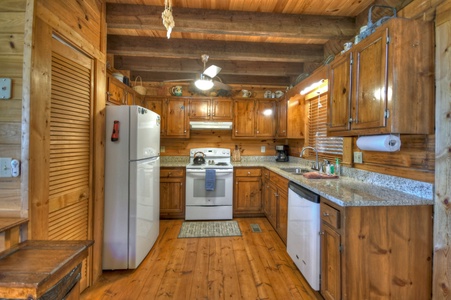 Ridgetop Pointaview- Full kitchen area with rustic ceiling beams