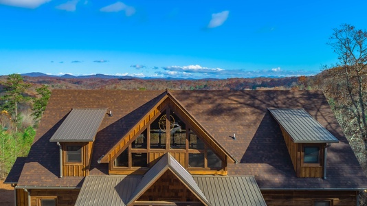 The Ridgeline Retreat- Aerial view of the cabin overlooking the mountains