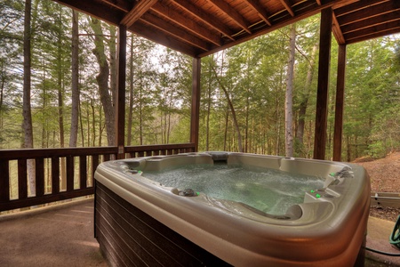 Reel Creek Lodge- Hot tub on the lower level deck with forest views