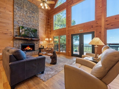 Bear Necessities- Living room area with a fireplace & TV