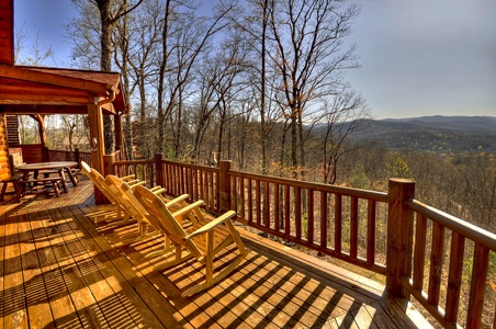 Grand Mountain Lodge- Deck with outdoor rocking chairs and long range mountain views