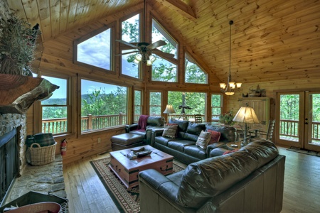Aska Lodge- Spacious living room with windows giving mountain views