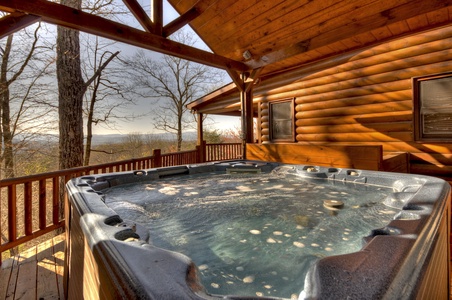 Grand Mountain Lodge- Hot tub with log cabin exterior