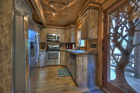 Hothouse Hideaway- Kitchen area with entryway door