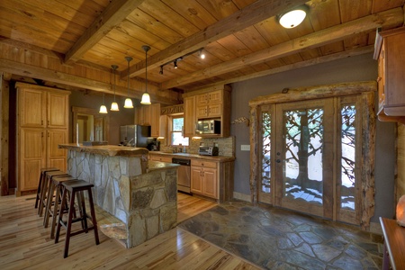 Reel Creek Lodge- Front entryway and fully equipped kitchen area