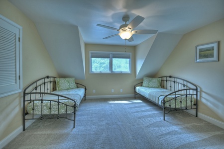 Upstairs bedroom with two twin beds