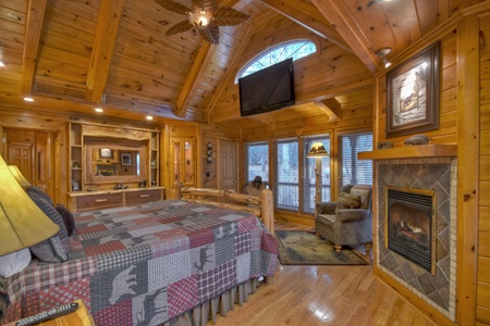 Deer Watch Lodge- Master bedroom with a fireplace