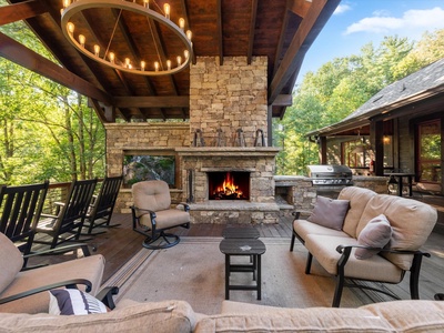 River Joy Lodge- Entry Level Deck Fireplace Seating Area