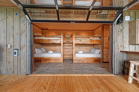 Feather & Fawn Lodge- Lower level guest bunk room with outdoor access