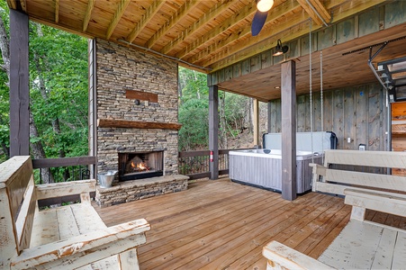 Feather & Fawn Lodge- Lower deck fireplace seating and hot tub