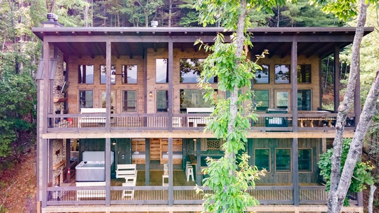 Feather & Fawn Lodge- Backside of the house featuring both decks