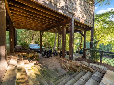 River Joy Lodge- Lower Level Covered Seating Area