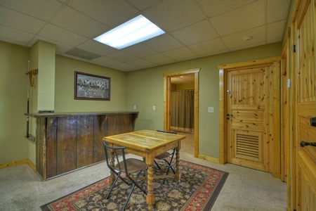 Above Ravens Ridge-  Lower level den area with a card table