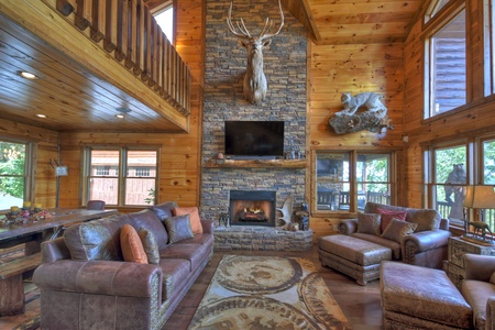 Grand Bluff Retreat- Living room view with fireplace and lounge furniture