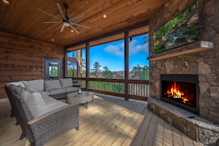The Ridgeline Retreat- Main level outdoor seating area with a fireplace