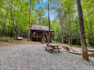 Lazy Bear Cove- Driveway view of the cabin and firepit