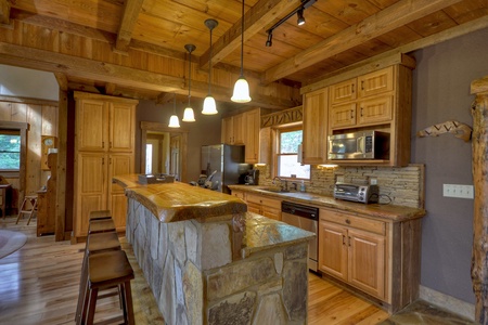 Reel Creek Lodge- Island area with stools in the kitchen