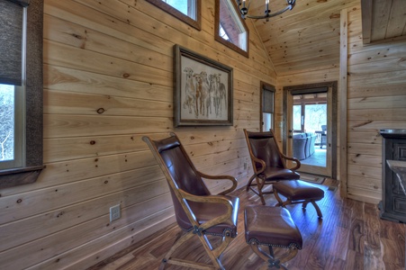 Whisky Creek Retreat- Main level bedroom seating area and deck access
