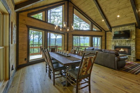 Vista Rustica- Dining room area with floor to ceiling windows