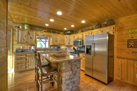 Grand Mountain Lodge-Fully equipped kitchen with an island and stools