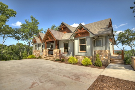 New Heights- Driveway view of the cabin with both entrances in view