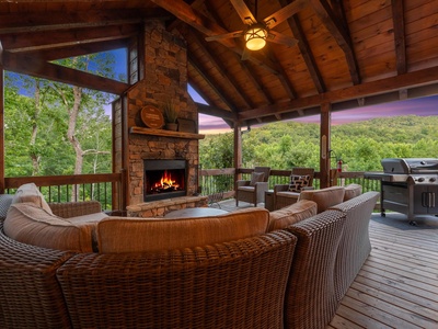 Whisky Creek Retreat- Entry deck fireplace with outdoor seating and a grill