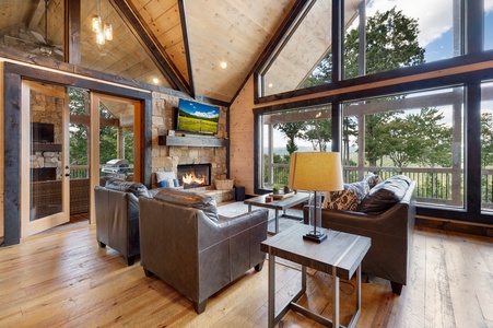 Mountain Echoes- Living room area with a fireplace and TV