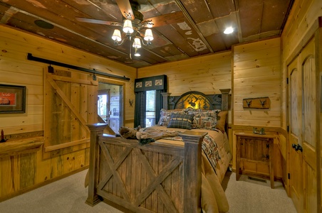 The Vue Over Blue Ridge- Bedroom with sliding window and rustic decor