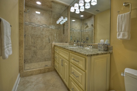 Jump Right In- Lower level bathroom area with walk in shower and vanity sink