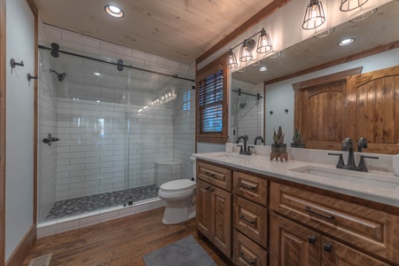 Southern Star- Upper full bathroom with a walk in shower and double vanity