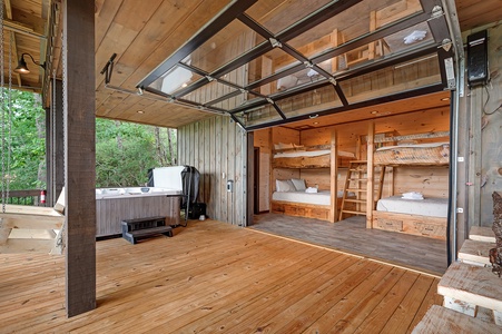 Feather & Fawn Lodge- Lower level deck bunk room access and hot tub