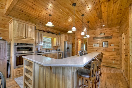 Above Raven Ridge- Large kitchen area with stool island seating