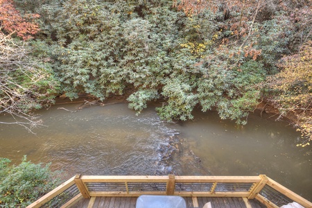 Happy Trout Hideaway- Upper level balcony view looking on the creek