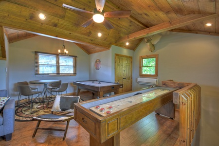 Grand Bluff Retreat- Upper level garage game room with shuffleboard