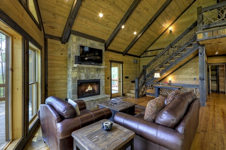 Vista Rustica- Living room area with fireplace and TV