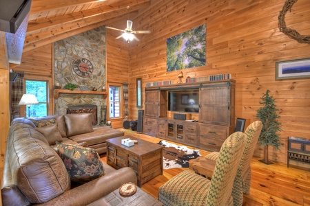 Falling Leaf- Living room area with seating, and an entertainment center