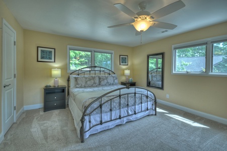 Jump Right In- Upstairs bedroom with upper level window views and a mirror