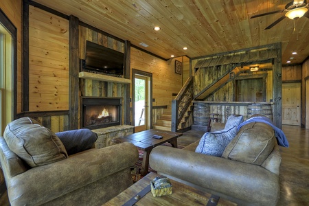 Vista Rustica- Lower level den area with TV and Fireplace