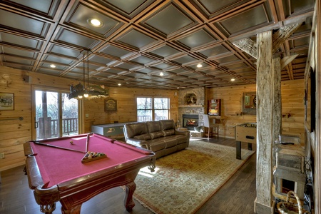 Grand Mountain Lodge- Full game room perspective with a fireplace