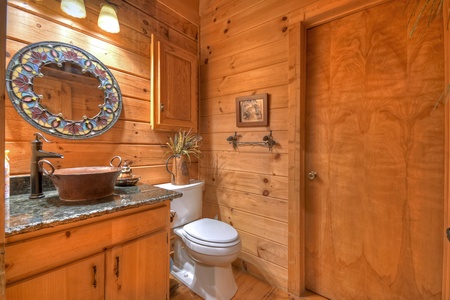 Falling Leaf- Master bathroom with a vanity sink and toilet