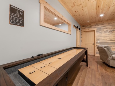 Creek Songs- Lower level living area with a shuffle board