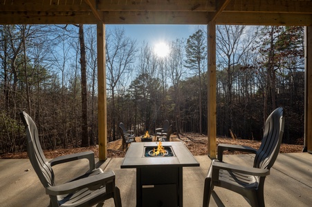 The Peaceful Meadow Cabin- Lower Level Porch Fire Pit Table